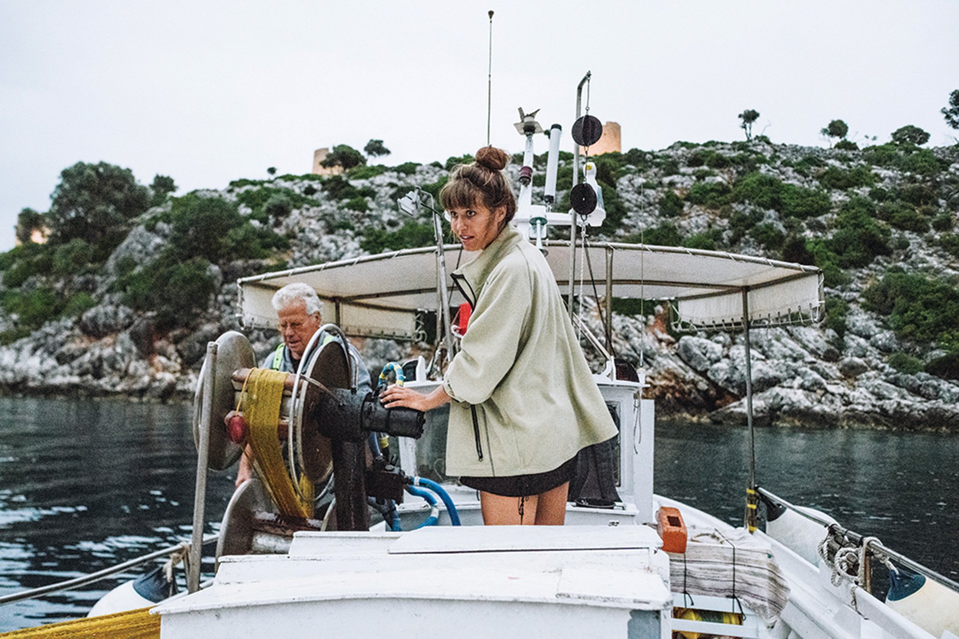 Helpining a local fisherman pull up his net.